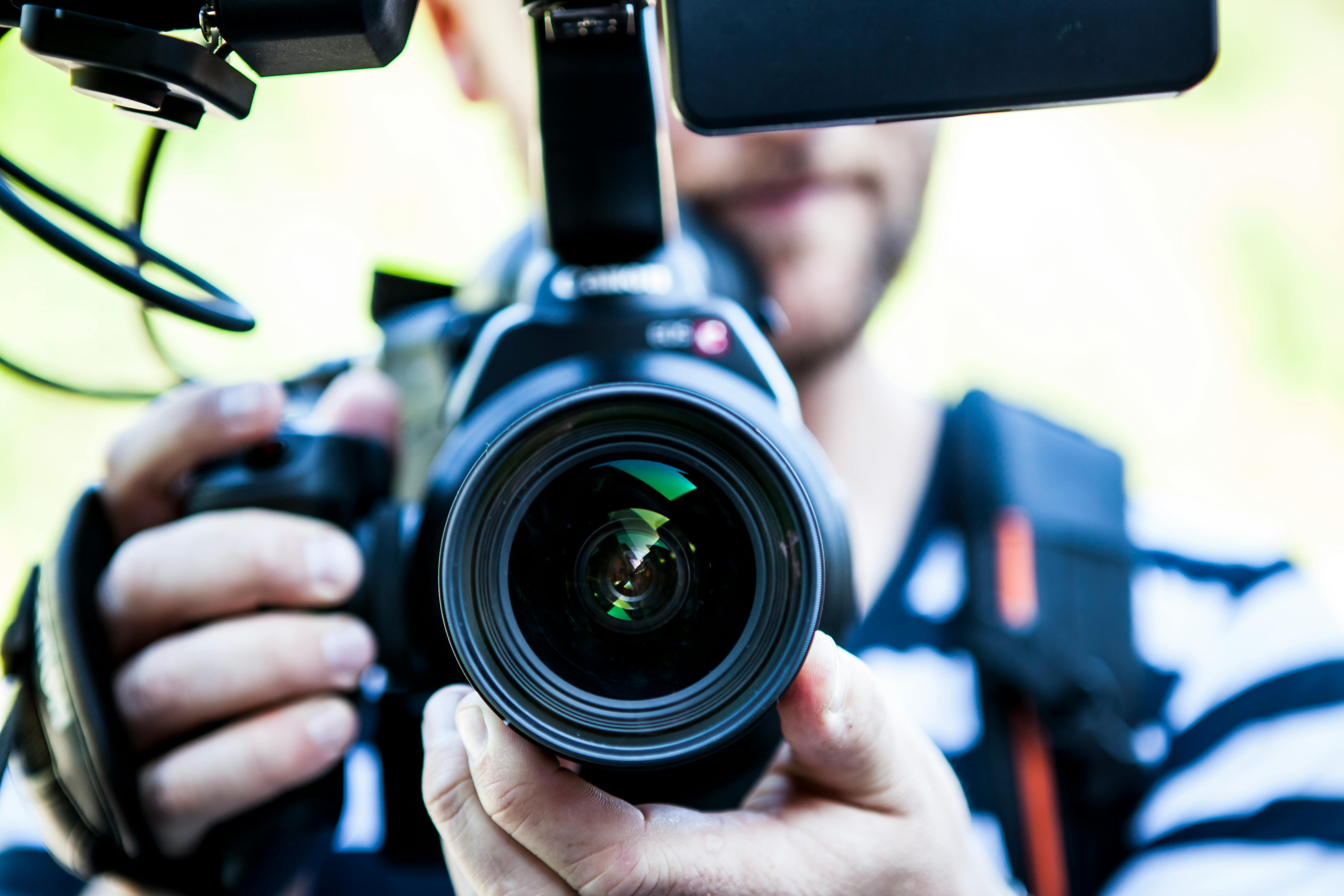 Professional content creator with video production equipment in creative workspace